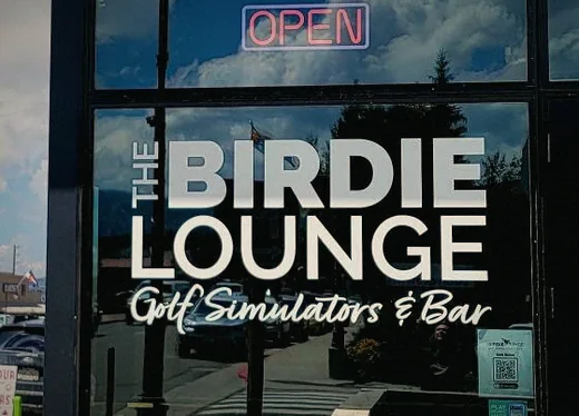 The painted Birdie Lounge wordmark on the front window.